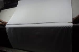 Fabric rolls measurement during an inspection by the Quality Control Blog